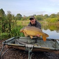 HERE IS DAVE EVANS WITH A 21LB 8OZ MIRROR CAUGHT FROM PEG 4.