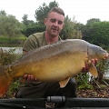 HERS IS CARL WOLSTENHOLME WITH A 29LB 14OZ MILLBROOK MIRROR (WOOLEY) CAUGHT FROM PEG (7) WELL DONE MATE GOOD ANGLING