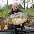 HERE IS ANDY GOODALL WITH A 23LB 14OZ MILLBROOK COMMON,CAUGHT FROM PEG 12. 