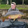 HERE IS DANIEL YORK WITH A 26LB 6OZ MIRROR CAUGHT FROM PEG 12.